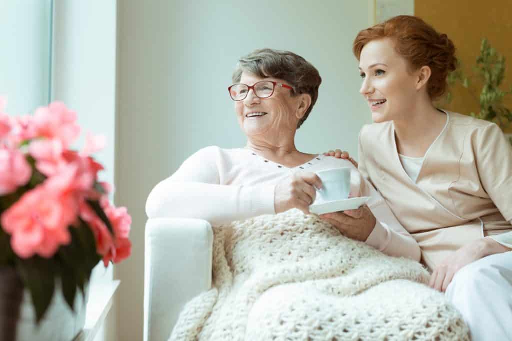 Mom and daughter spending time together in the living room on a cloudy day